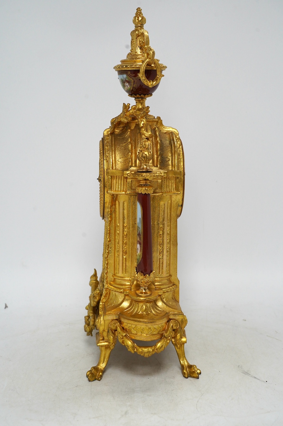 A 19th century French gilt spelter and porcelain mantel clock with pendulum, no key, 42cm. Condition - good, not tested as working